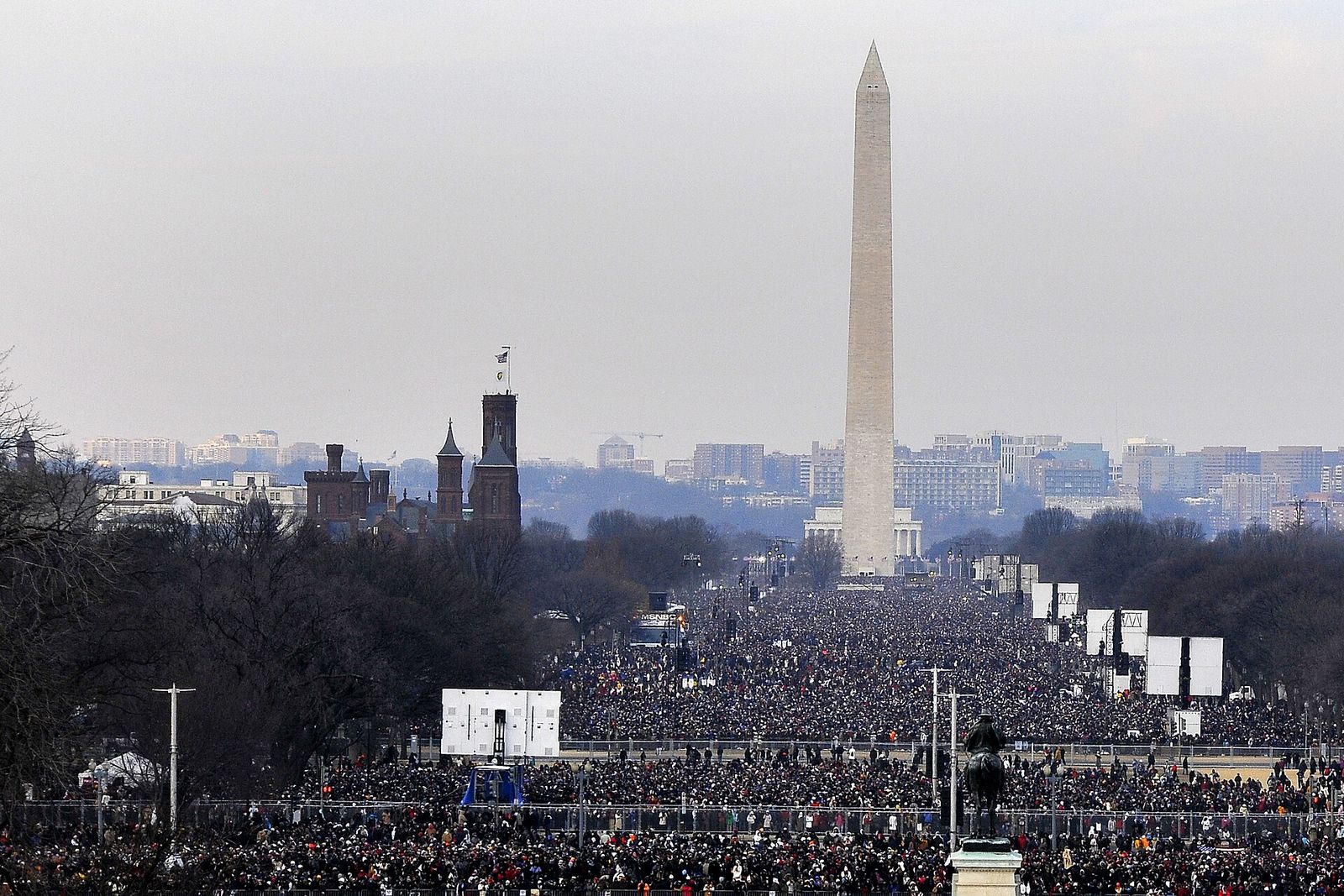 Hundreds of thousands of people fill the National Mall toward the Washington Monument on inauguration day.