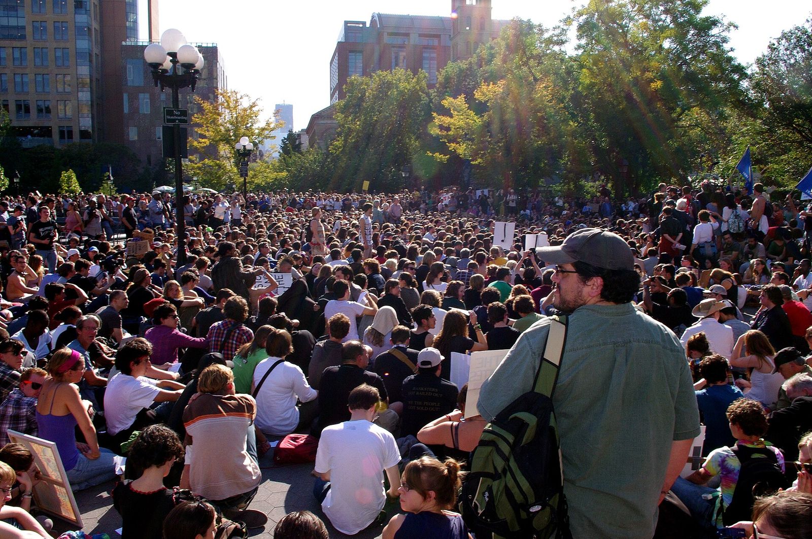 A large crowd seated in Washington Square Park for an Occupy Wall Street General Assembly.