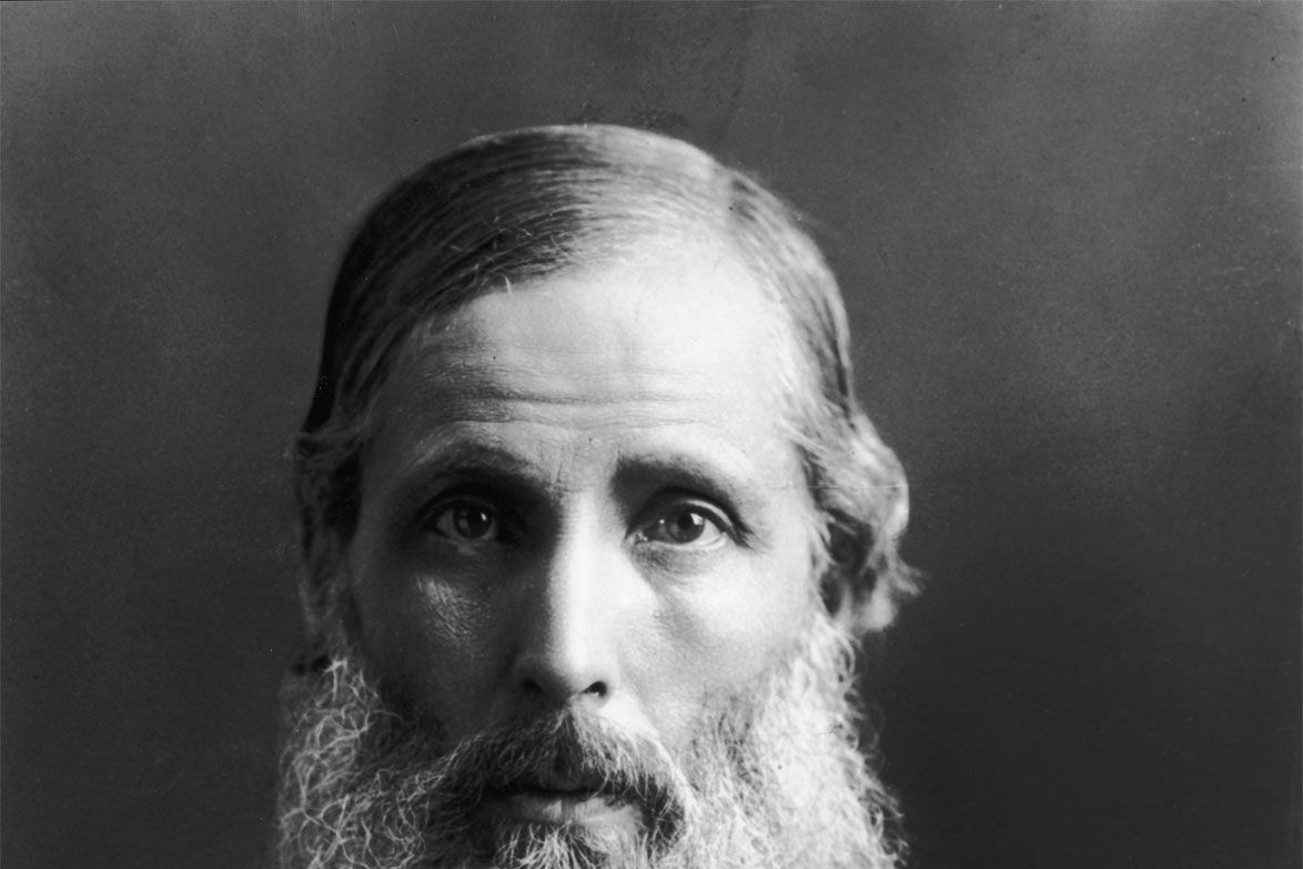 Black-and-white studio portrait of Henry Sidgwick, an elderly man with a long white beard.