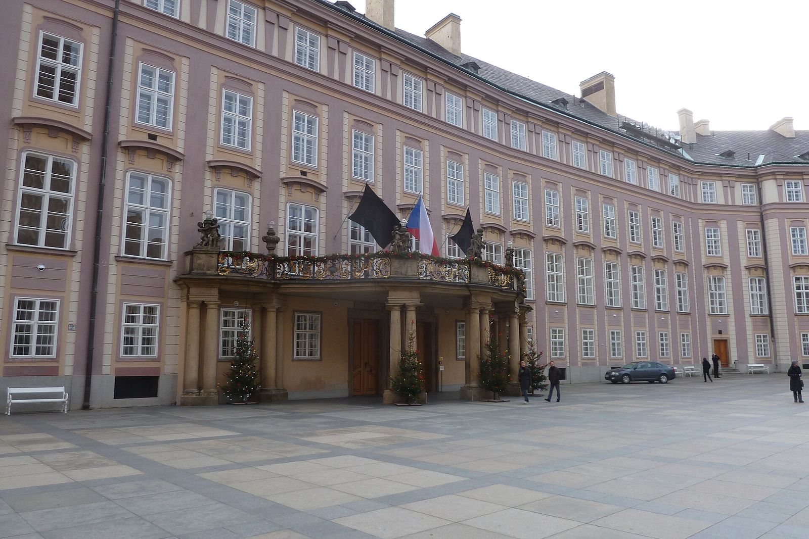 Black flags flying from a balcony of the Prague Castle courtyard in mourning for Václav Havel.
