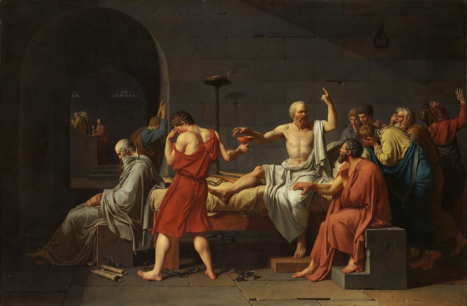 Socrates, seated on his bed and raising a finger, addresses his grieving followers before drinking the hemlock.